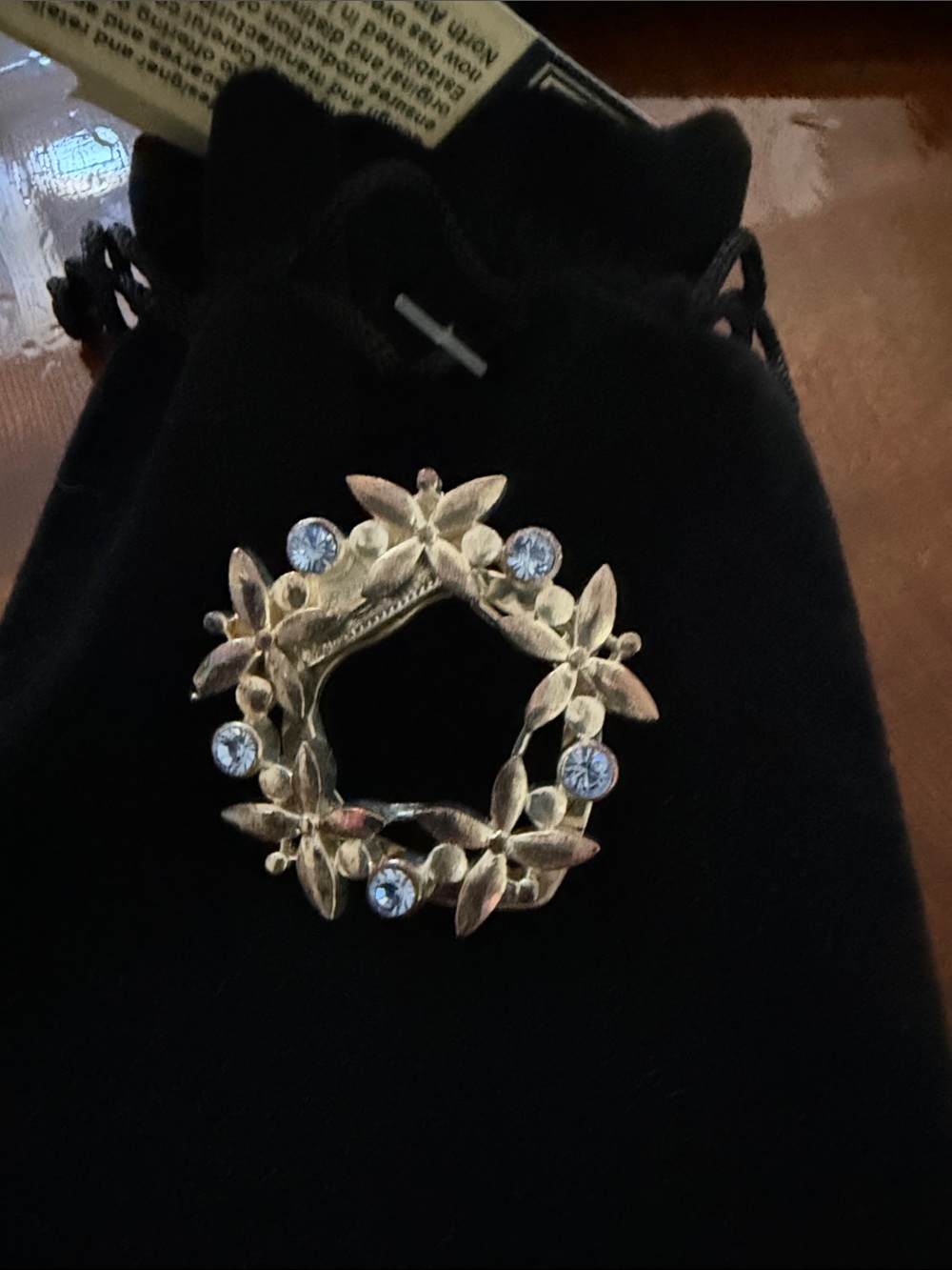 The Rack Silver tone Floral Wreath Scarf Clip with Light Blue Crystals